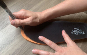 Step 2 of how to trim you insoles in 4 simple steps; Use the liner from the shoe as a pattern